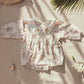 Floral organic cotton long sleeved girl romper