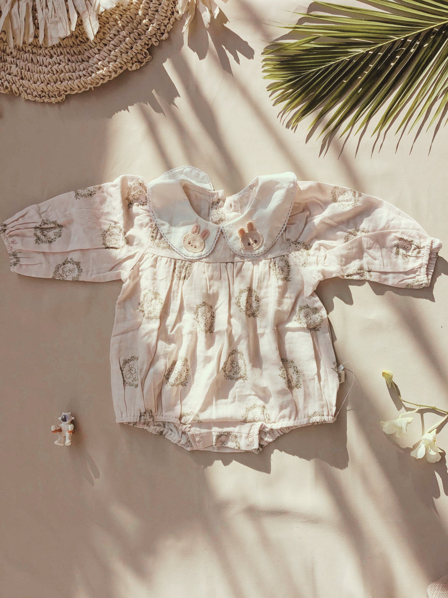 Floral organic cotton long sleeved girl romper