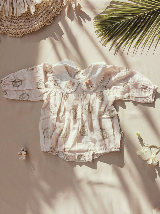 Floral organic cotton long sleeved girl romper