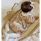 Floral organic cotton long sleeved girl romper