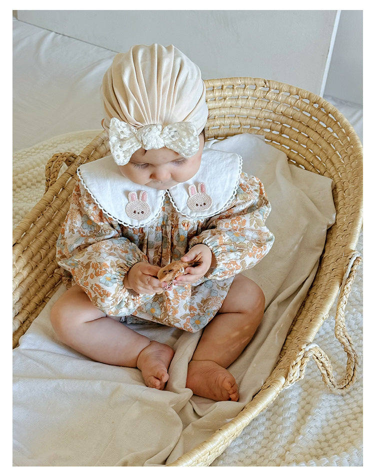 Floral organic cotton long sleeved girl romper