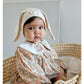 Floral organic cotton long sleeved girl romper