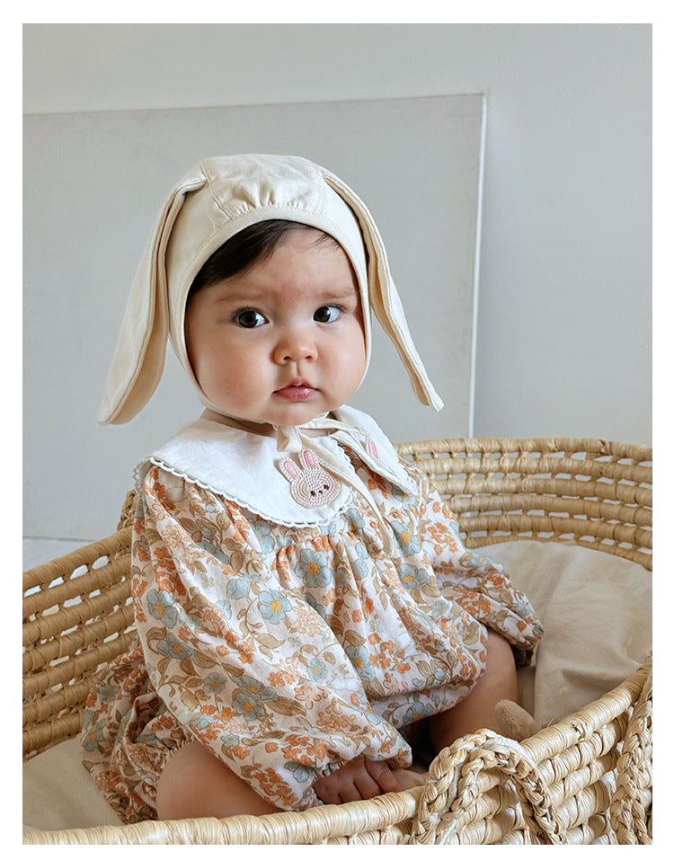 Floral organic cotton long sleeved girl romper