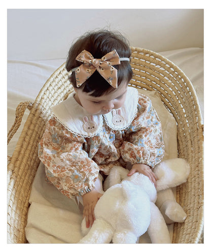 Floral organic cotton long sleeved girl romper