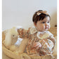 Floral organic cotton long sleeved girl romper