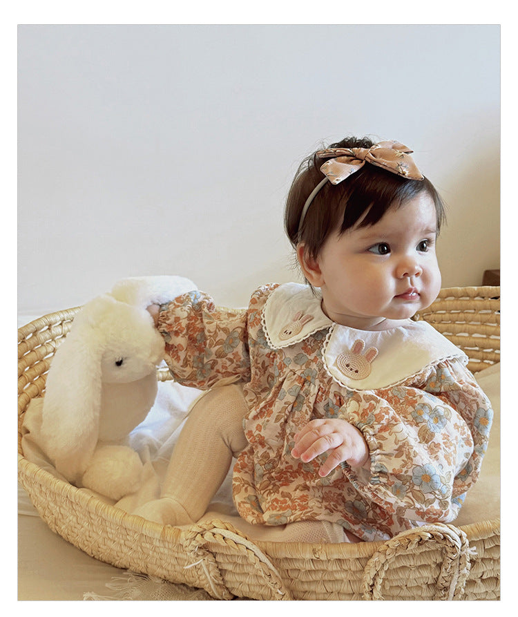 Floral organic cotton long sleeved girl romper