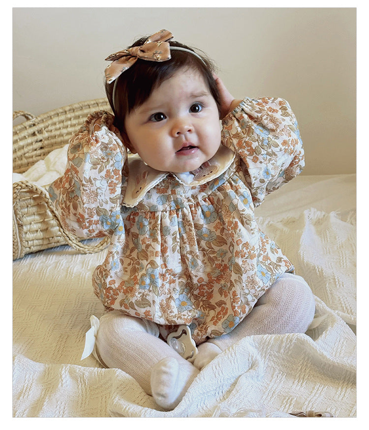 Floral organic cotton long sleeved girl romper