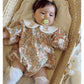 Floral organic cotton long sleeved girl romper