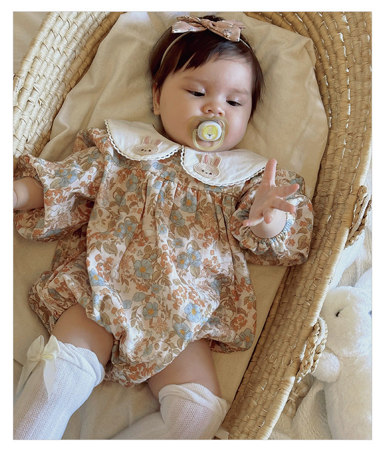Floral organic cotton long sleeved girl romper