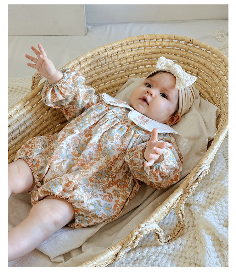 Floral organic cotton long sleeved girl romper