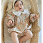 Floral organic cotton long sleeved girl romper