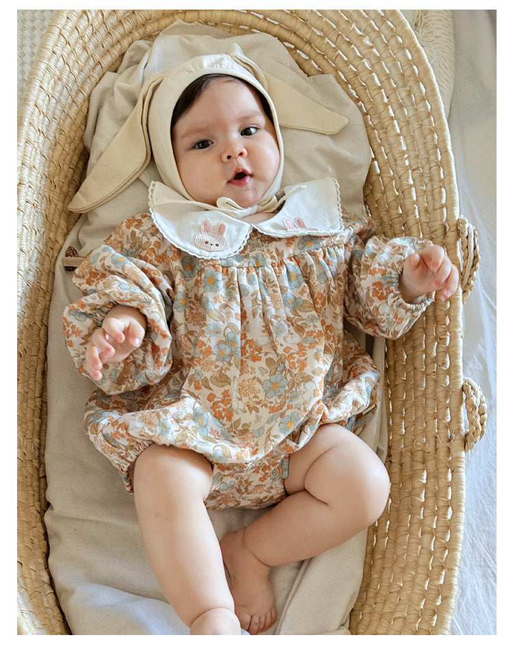 Floral organic cotton long sleeved girl romper
