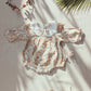 Floral organic cotton long sleeved girl romper
