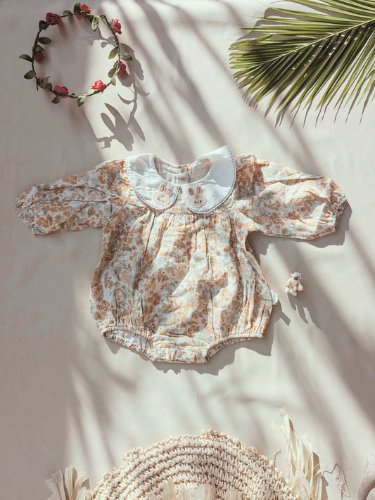 Floral organic cotton long sleeved girl romper