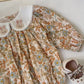 Floral organic cotton long sleeved girl romper